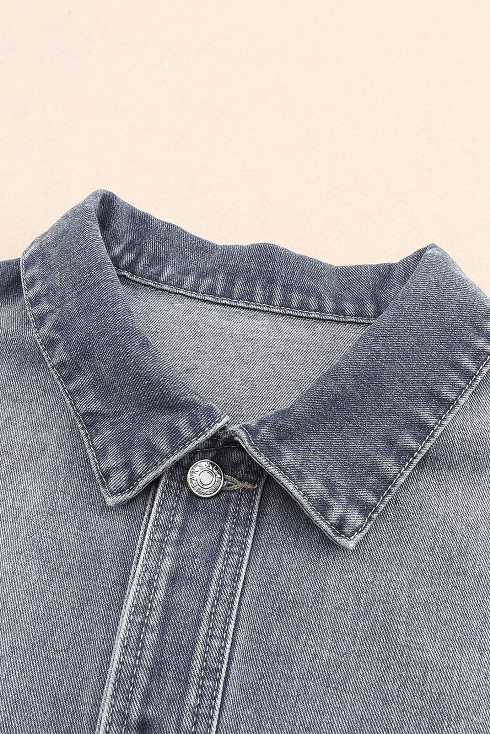 Get ready to rock any look with our Gray Chest Pockets Drop Shoulder Loose Denim Jacket. The ultimate layering piece, its versatile fit is perfect for all body types. The metal buttons add a touch of cool and durability, while the drop shoulder design gives off an effortless vibe. Plus, the chest pockets add both practicality and style.