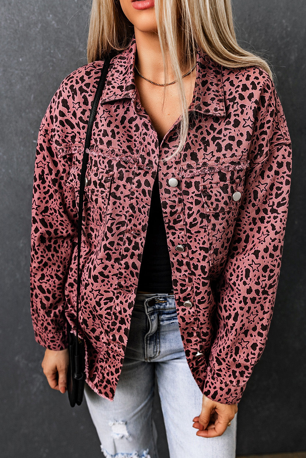 Unleash your wild side with our Pink Stars &amp; Animal Spots Print Button Up Denim Shacket. The leopard spot and heart and stars print adds a stylish touch, while the chest pockets make it practical. The distressed design keeps you on trend. Perfect for pairing with a crop top, t shirt, pants, sneakers, and other accessories.