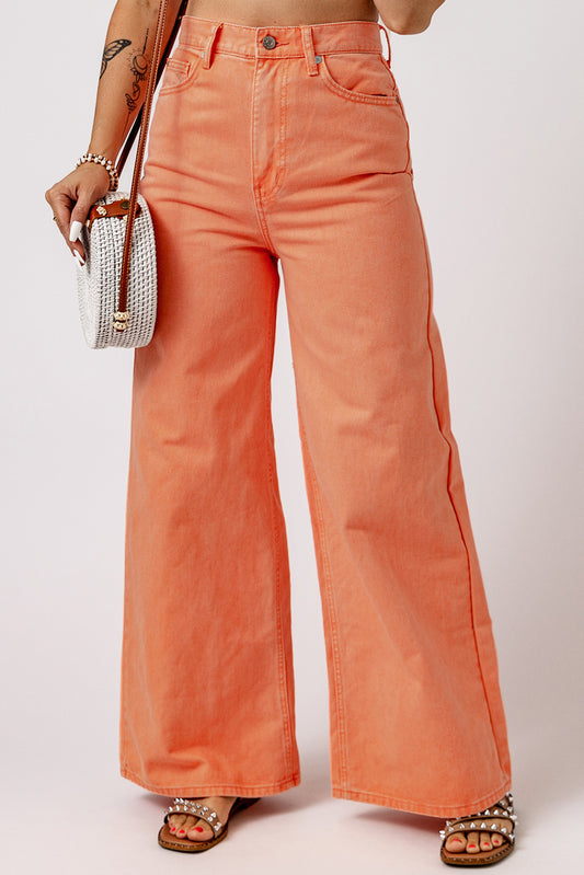 Elevate your style with our Orange Acid Wash High Waist Wide Leg Jeans! The high waist and wide leg design offer both fashion and comfort, while functional front and back pockets provide convenience. Made to make you feel chic and slender, these jeans are a statement piece you won't want to miss!