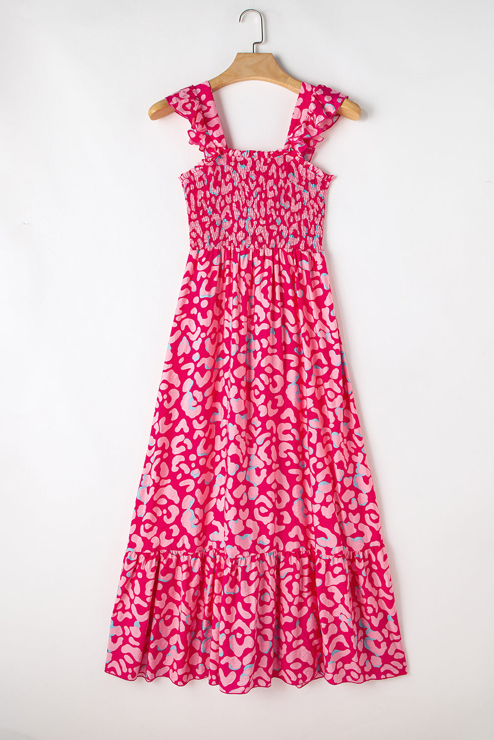 Indulge in the fierce yet feminine style of our Pink Leopard Ruffle Straps Smocked High Waist Long Dress. With its playful ruffle straps and flattering smocked high waist design, this dress will have you feeling confident and stylish. The bold pink leopard print adds a touch of wildness to any occasion.