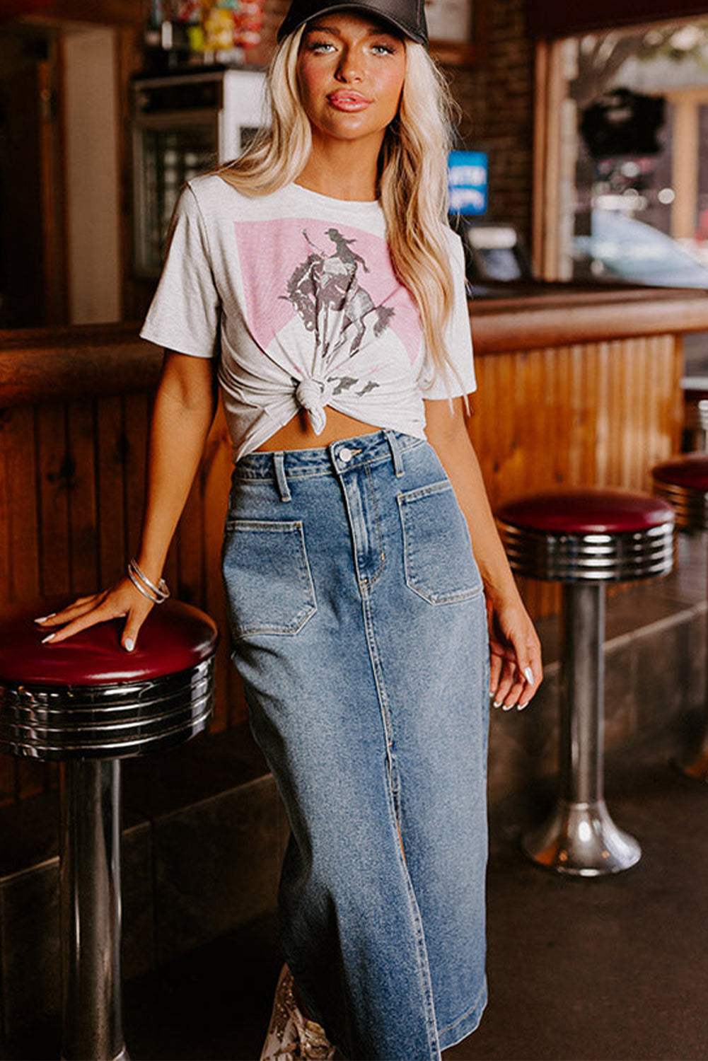 Elevate your wardrobe with our Classic Sky Blue Midi Denim Skirt! This stylish piece features a front slit and convenient pockets, adding a modern touch to the classic denim design. Perfect for any occasion, feel confident and fashionable in this must-have piece!