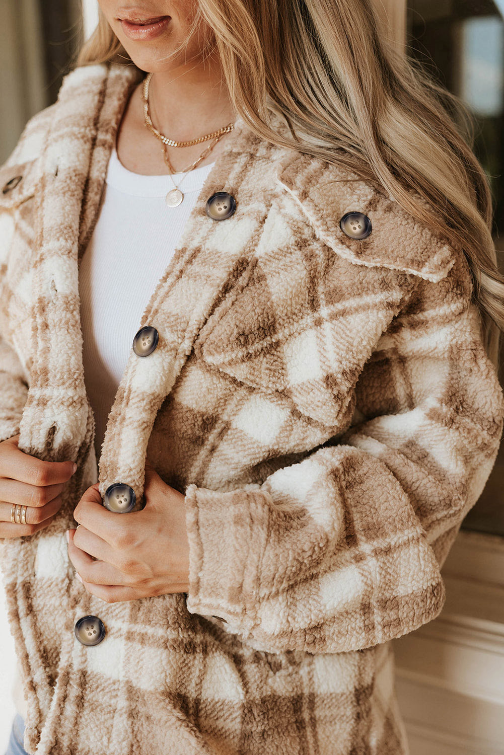 Stay warm and stylish with our Khaki Sherpa Plaid Button Pocketed Jacket. Made with soft sherpa, this jacket will keep you comfortable all day long. The spacious pockets allow for easy storage of essentials. Crafted with high-quality materials, you can count on this jacket to last. The classic plaid pattern and button front add a timeless touch to any outfit.