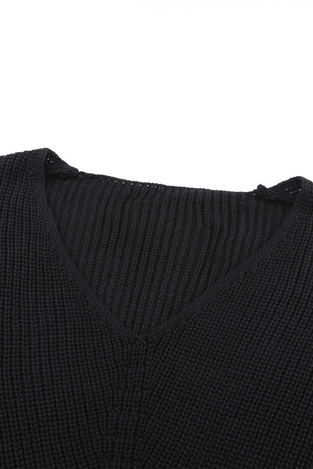 Cozy up in style with our Black Ribbed Knit V Neck Sweater. Made with a soft and stretchy ribbed knit fabric, this sweater features a flattering v neck design. Perfect for pairing with jeans or leggings, it's a versatile and stylish addition to any wardrobe.