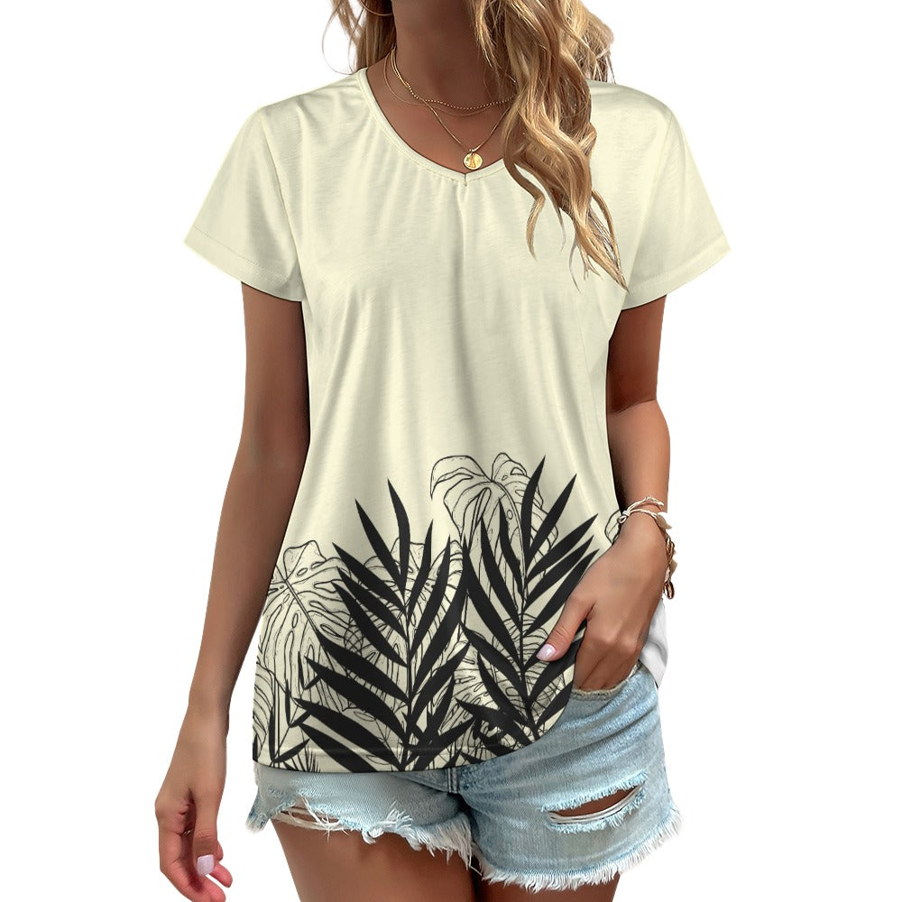 Elevate your style with our beige designer graphic V-neck short sleeve t-shirt and matching slacks. The black silhouette tropical leaf print adds a touch of tropical elegance to your look. Step into the world of effortless sophistication with this versatile and stylish outfit.