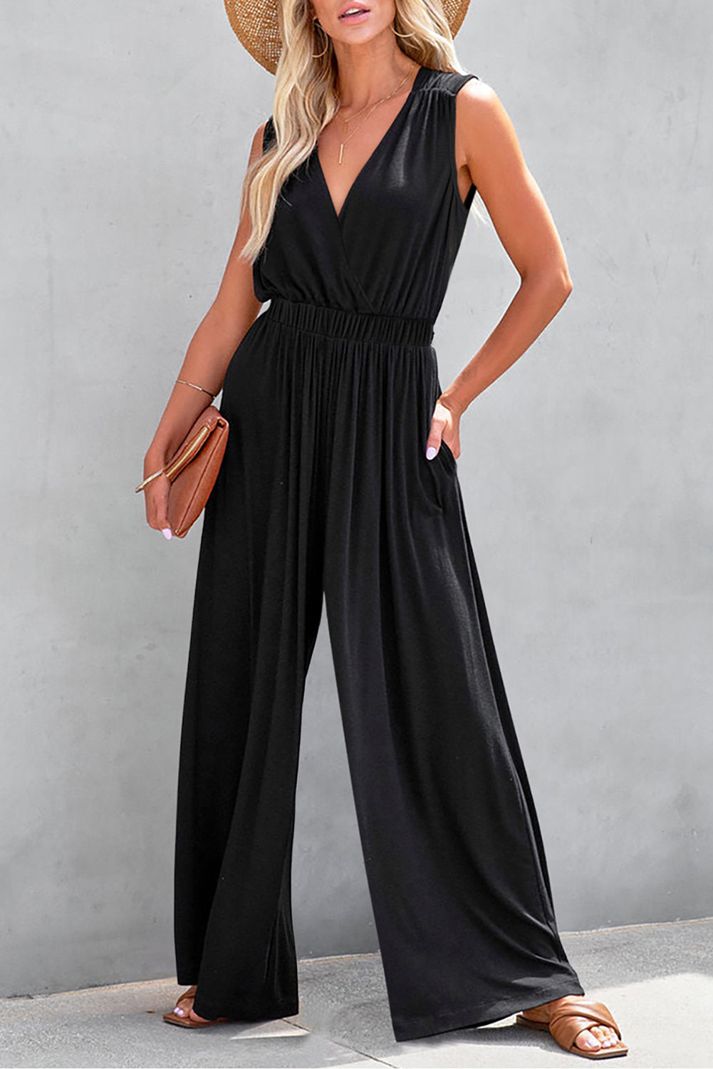 Get ready to turn heads with our Black Deep V Neck Pleated Crisscross Wide Leg Casual Backless Jumpsuit! This chic and versatile piece features a trendy deep v neck and a unique crisscross design, while the pleated details and wide leg cut give it a flattering and stylish look. Perfect for any occasion, from a casual day out to a night out on the town!