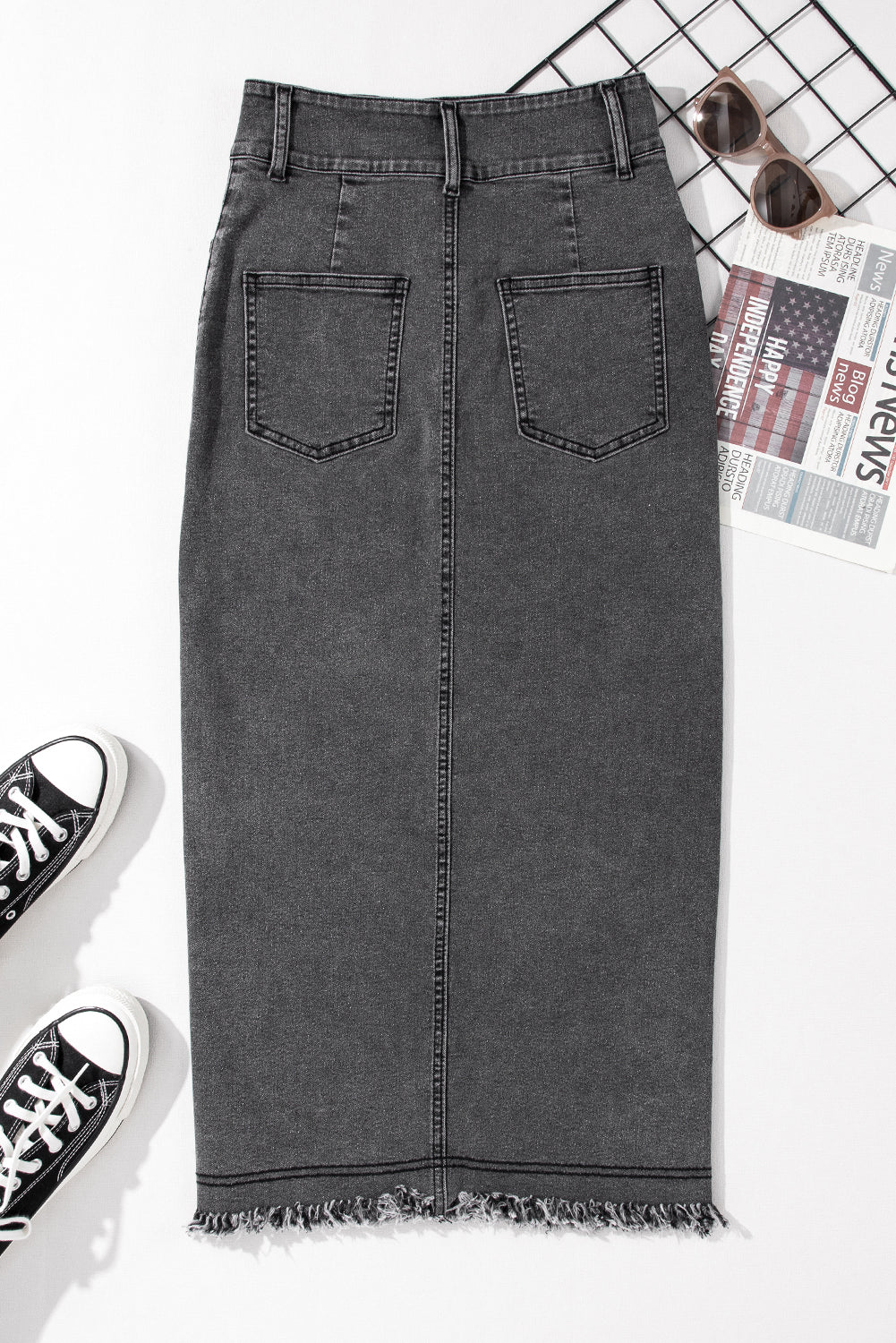 Introducing our stunning Black Raw Edge Side Slits Button Up Midi Denim Skirt! Crafted with high-quality denim, this skirt is perfect for any occasion. The raw edge and side slits add a touch of edginess, while the button-up design adds a dash of sophistication. Elevate your wardrobe with this must-have piece!