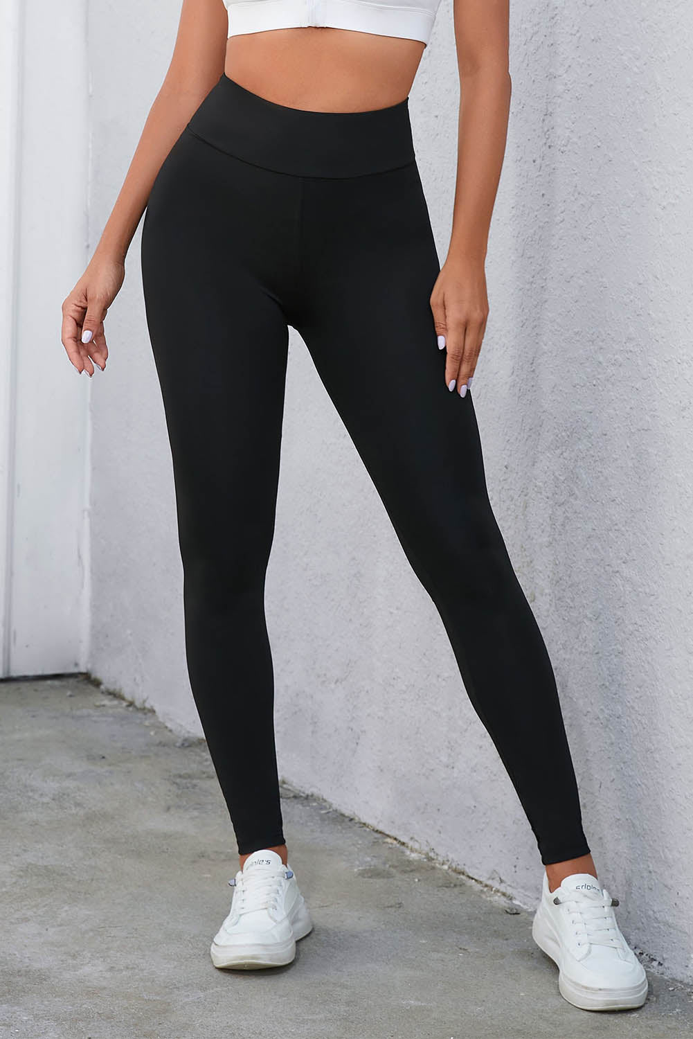 Flaunt your figure with our Black Criss Cross Tummy Control High Waist Leggings! Designed to give you a sleek and smooth silhouette, these leggings feature a high waist and criss cross detailing to enhance your curves and provide ultimate tummy control. Feel confident and comfortable all day long!