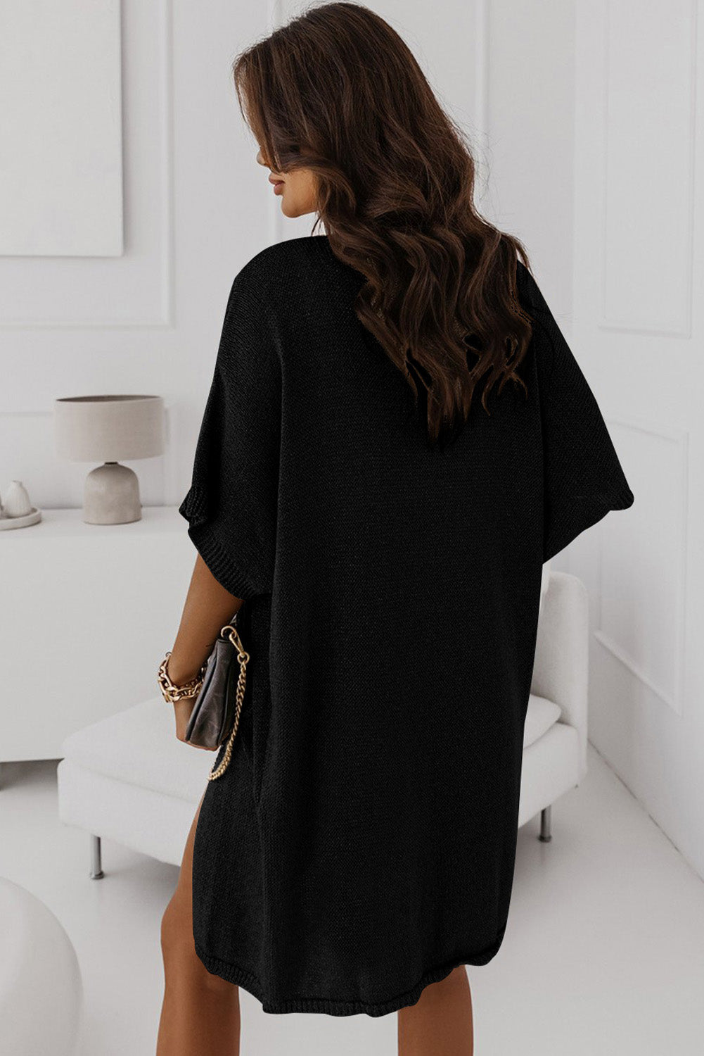 Add some edge to your outfit with our Black Dolman Half Sleeve Pocketed Long Cardigan. This versatile piece brings comfort and style with its half sleeves and convenient pockets. Perfect for any occasion, it's a must-have for your wardrobe!