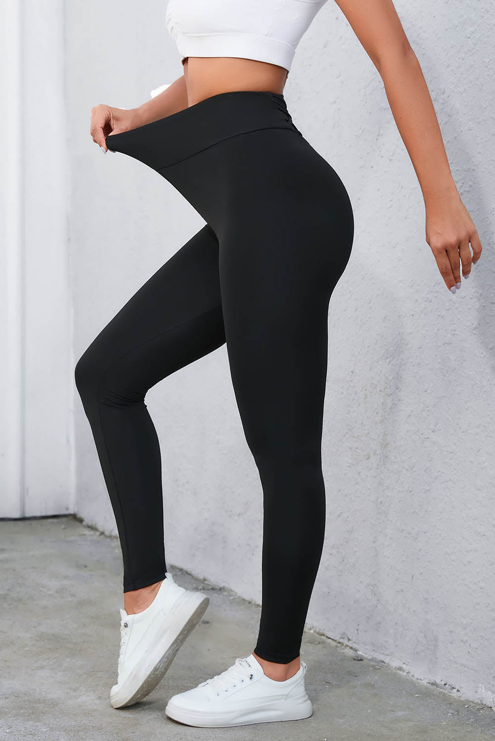 Flaunt your figure with our Black Criss Cross Tummy Control High Waist Leggings! Designed to give you a sleek and smooth silhouette, these leggings feature a high waist and criss cross detailing to enhance your curves and provide ultimate tummy control. Feel confident and comfortable all day long!