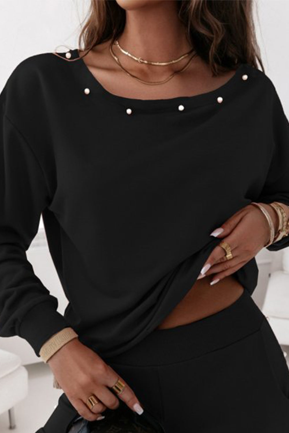 Elevate your loungewear game with our Black Beaded Decor Pullover and Jogger Pants Set. The intricate beaded design adds a touch of glam while the soft and comfortable fabric ensures maximum coziness. Stay stylish and comfortable in this must-have set.