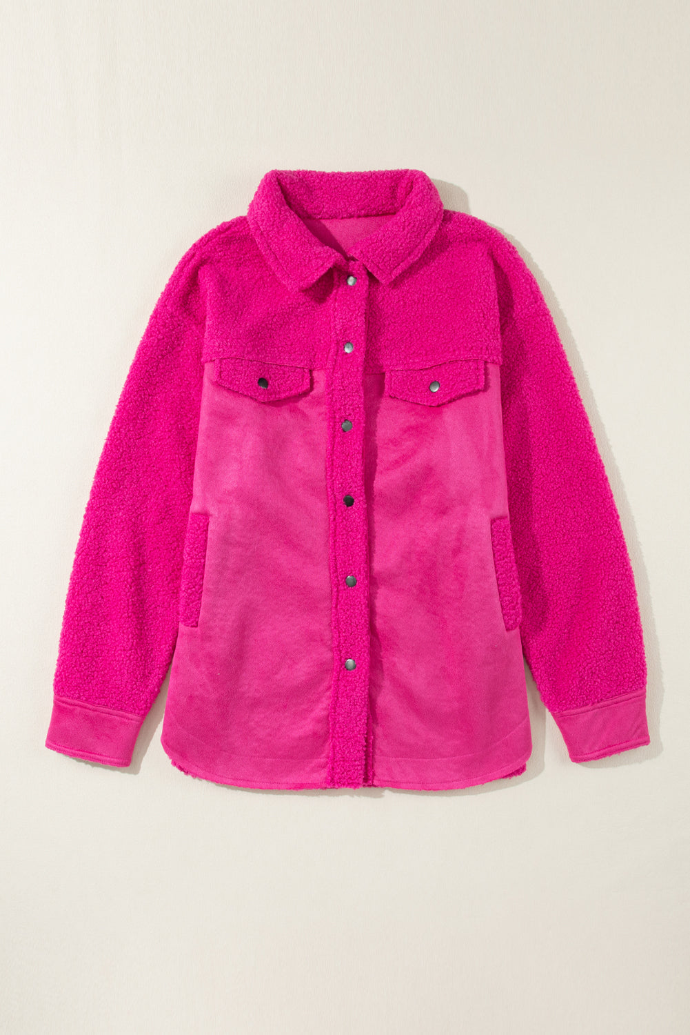 Introducing a cozy yet vibrant addition to your wardrobe: the Bright Pink Faux Suede Sherpa Button-Up Cardigan. Crafted with comfort and style in mind, this cardigan offers both warmth and flair, perfect for the modern woman who values both fashion and functionality