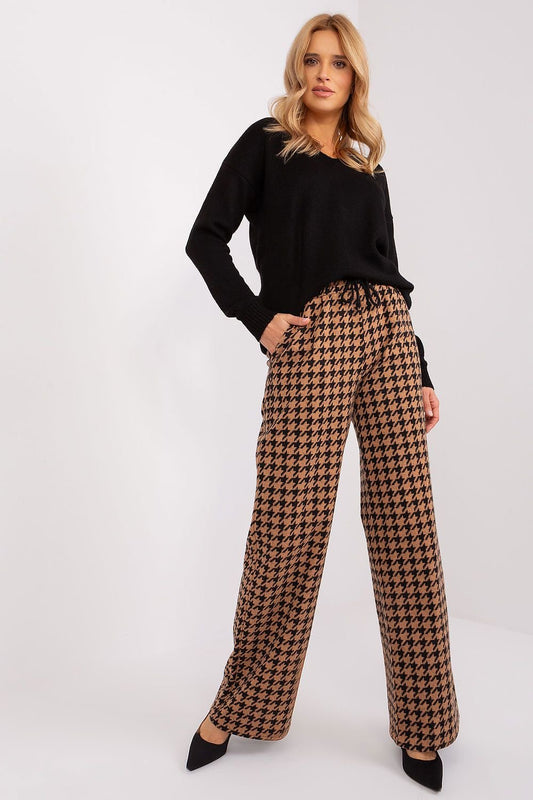 Elevate your style with our Casual High-Waisted Pants! These wide-legged, gray-black pants feature a trendy waist tie and convenient slip pockets. Perfect for any occasion, these pants will take your outfit to the next level.