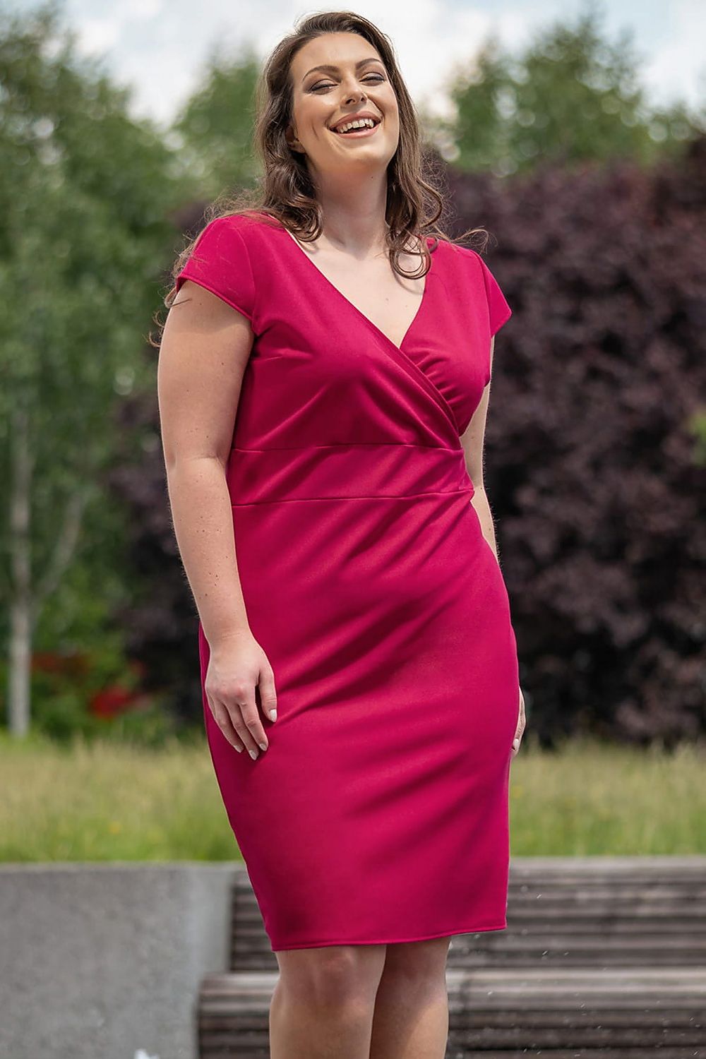 This plus size dress will make you feel elegant and confident! Designed with a flattering V-neckline and short sleeves, this dress is perfect for any occasion. Made from a comfortable knit fabric, it will hug your curves and provide a stylish look. Show off your fashion sense with this stunning dress!