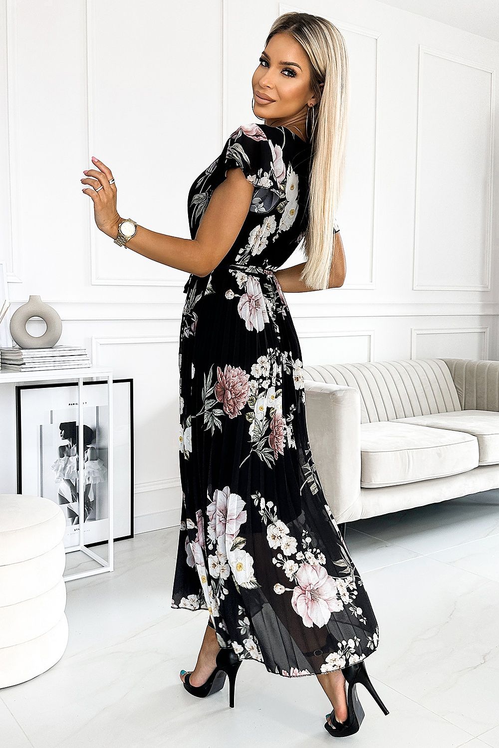 Experience effortless grace and beauty with our Mid Length Floral Print Pleated Chiffon Dress. The delicate floral print and elegant ruffles perfectly accent the flowy chiffon fabric, creating a flattering and feminine silhouette. Ideal for any occasion, this dress is sure to make you feel confident and stunning.