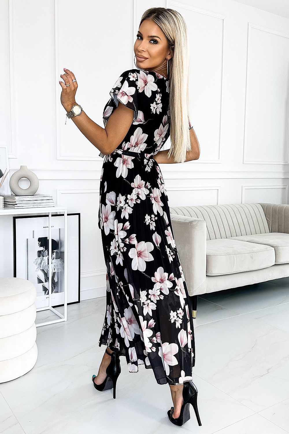 Experience effortless grace and beauty with our Mid Length Floral Print Pleated Chiffon Dress. The delicate floral print and elegant ruffles perfectly accent the flowy chiffon fabric, creating a flattering and feminine silhouette. Ideal for any occasion, this dress is sure to make you feel confident and stunning.