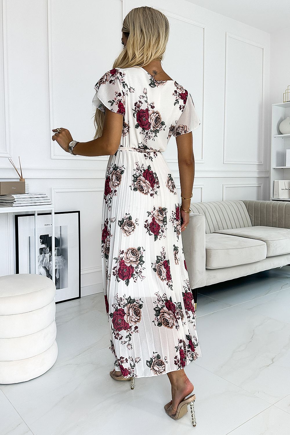 Experience effortless grace and beauty with our Mid Length Floral Print Pleated Chiffon Dress. The delicate floral print and elegant ruffles perfectly accent the flowy chiffon fabric, creating a flattering and feminine silhouette. Ideal for any occasion, this dress is sure to make you feel confident and stunning.