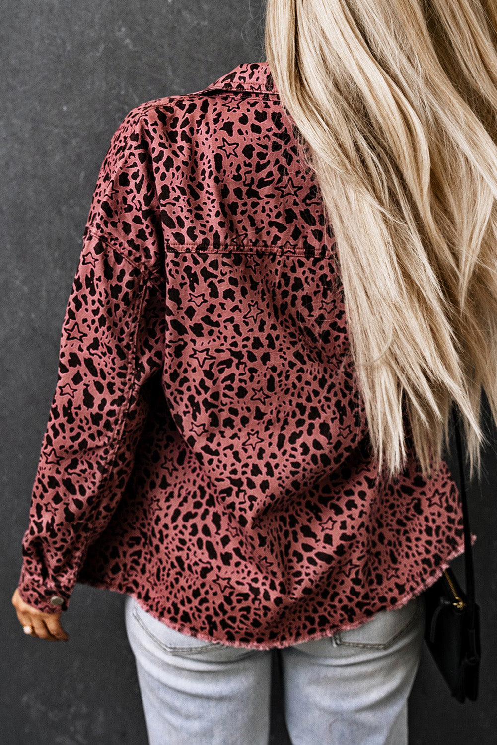 Unleash your wild side with our Pink Stars &amp; Animal Spots Print Button Up Denim Shacket. The leopard spot and heart and stars print adds a stylish touch, while the chest pockets make it practical. The distressed design keeps you on trend. Perfect for pairing with a crop top, t shirt, pants, sneakers, and other accessories.