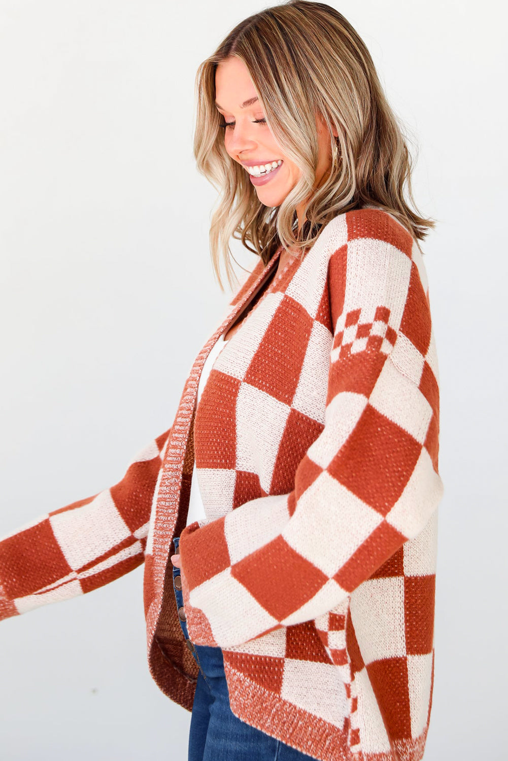 Introducing our Chestnut Mix Checkered Cardigan, a chic and classic addition to any wardrobe. Its checkered pattern is sure to make you fall in love with this knit coat. The open front design makes it easy to layer over any outfit, perfect for pairing with jeans, skirts, or dresses.