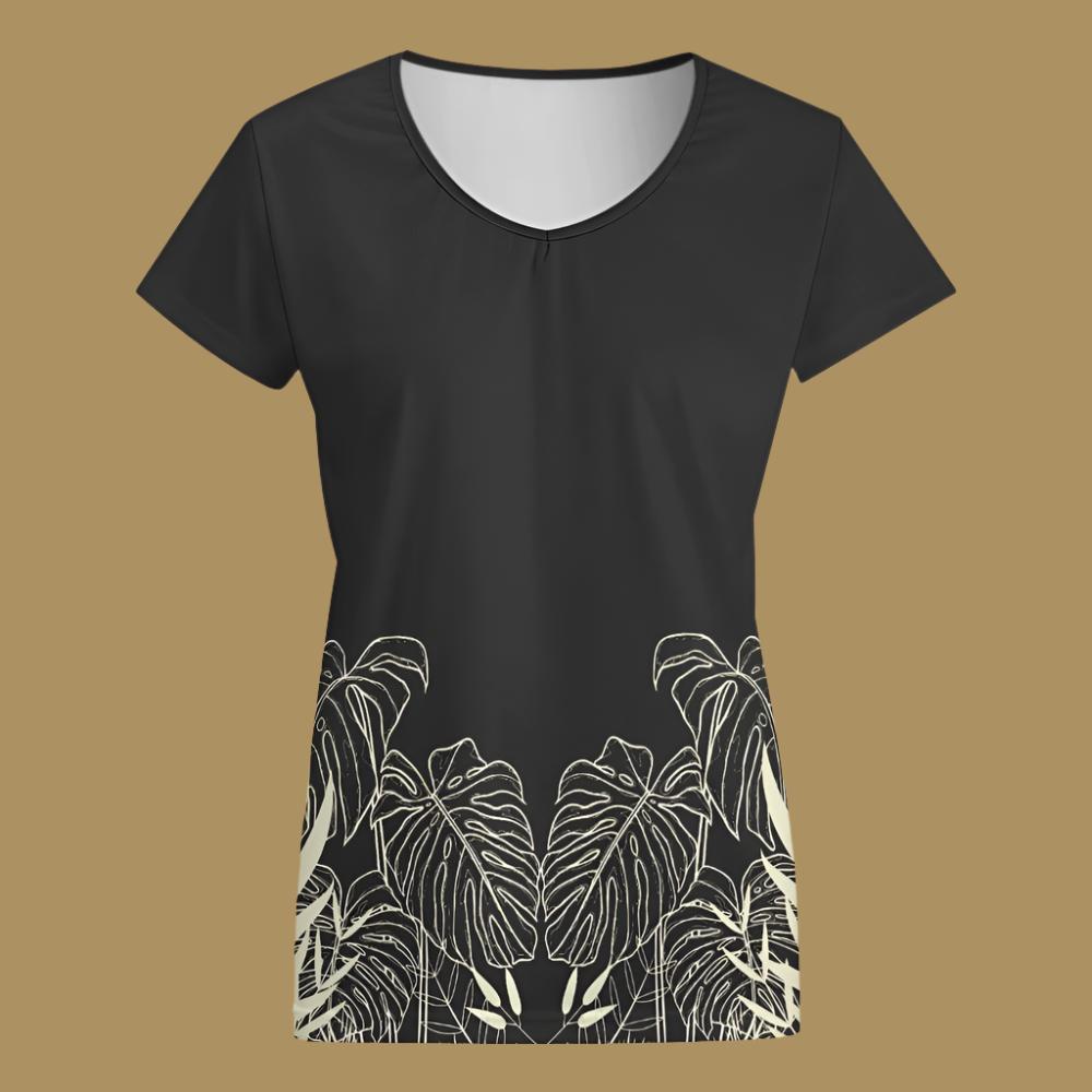 The front of the top. Rounded V neck. Short sleeves.   Stay effortlessly stylish and comfortable with our Black Designer Original Graphic Print V-Neck T-shirt! The tropical leaf print wrapping around just above the hemline adds a unique touch. Pair it with the matching slacks for a complete, chic look. Upgrade your wardrobe with this must-have piece!