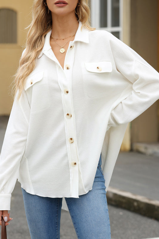 Elevate your style with our White Button-Up Long Sleeve Shirt. This classic piece offers a clean and polished look, perfect for any occasion. With a timeless white color, button-up design, and long sleeves, this shirt will keep you looking sharp and confident throughout your day. Dress it up or down, the possibilities are endless. Upgrade your wardrobe with this must-have shirt now!