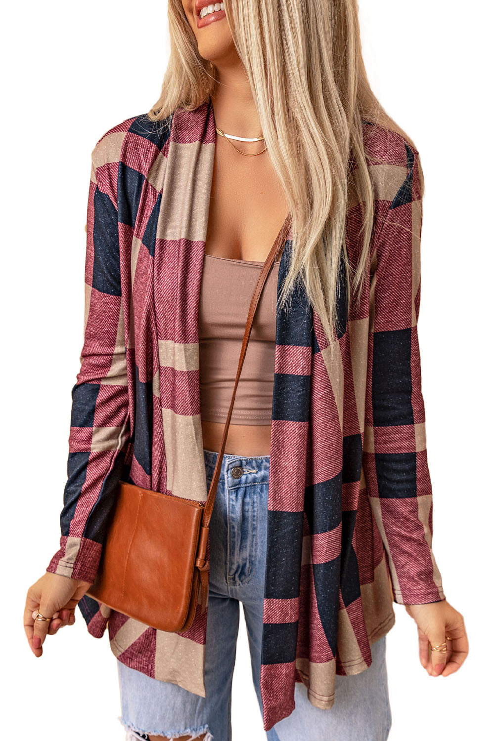 Unleash your inner fashionista with our Draped Open Front Plaid Cardigan. This versatile piece adds a touch of casual chic to any outfit. The draped design creates a relaxed look, while the open front allows for easy styling with a t-shirt, jeans, and sneakers. Made with soft and lightweight fabric for a cozy feel. Unleash your style and comfort with this must-have cardigan.