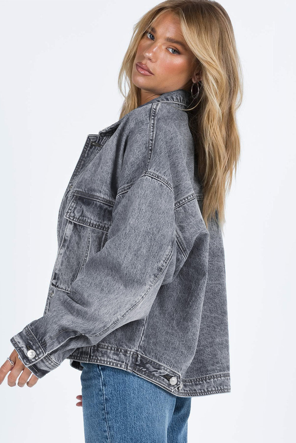 Get ready to rock any look with our Gray Chest Pockets Drop Shoulder Loose Denim Jacket. The ultimate layering piece, its versatile fit is perfect for all body types. The metal buttons add a touch of cool and durability, while the drop shoulder design gives off an effortless vibe. Plus, the chest pockets add both practicality and style.