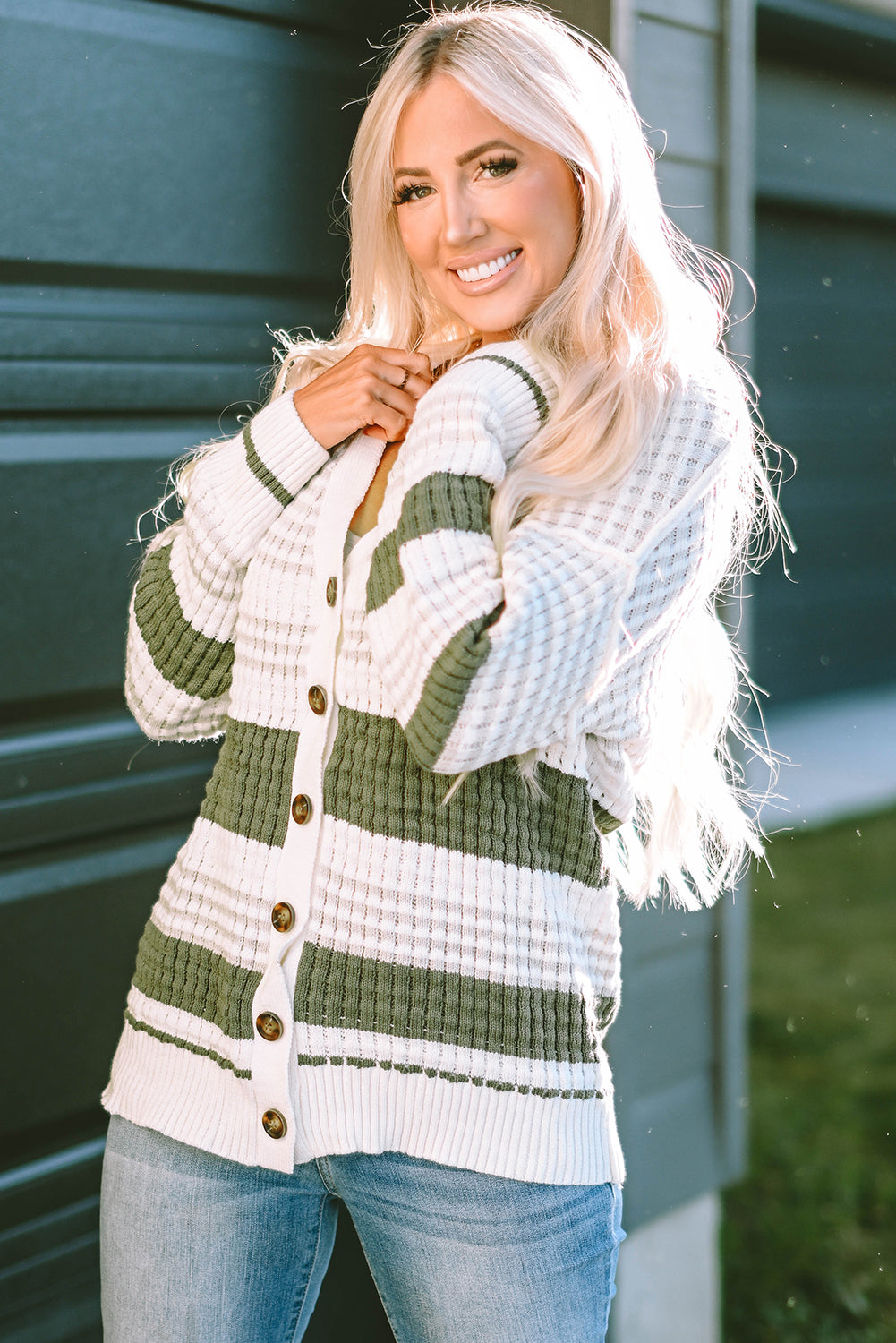 Get ready to add some color to your wardrobe with this Green Colorblock Textured Knit Buttoned Cardigan! The block-striped lightweight weave brings a playful touch to any outfit, while the rows of buttons down the front make for easy layering. Plus, the carefully knitted patterns and ribbed details add a touch of elegance to this quirky and fun cardigan.