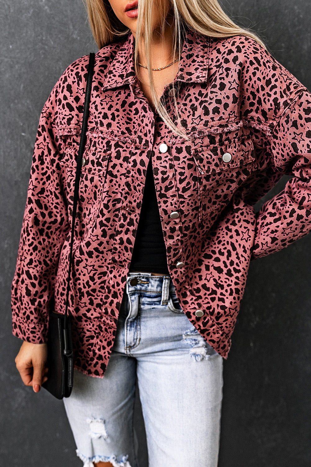 Unleash your wild side with our Pink Stars &amp; Animal Spots Print Button Up Denim Shacket. The leopard spot and heart and stars print adds a stylish touch, while the chest pockets make it practical. The distressed design keeps you on trend. Perfect for pairing with a crop top, t shirt, pants, sneakers, and other accessories.